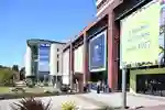 Allam Medical Building and Bymore Jones Library exteriors on a sunny day.