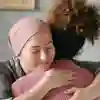 Patient being hugged by a care worker