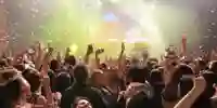 People waving arms at a Swiftogeddon night