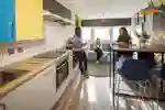 Students in the kitchen area in Taylor Court