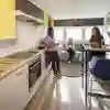 Students in the kitchen area in Taylor Court