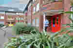 A Student at the Entrance to Taylor Court