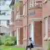 A student sat outside Taylor Court