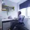 A Student in their Room at the desk in Taylor Court