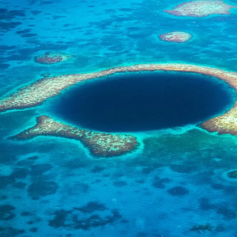 A large blue hole within a reef in the ocean