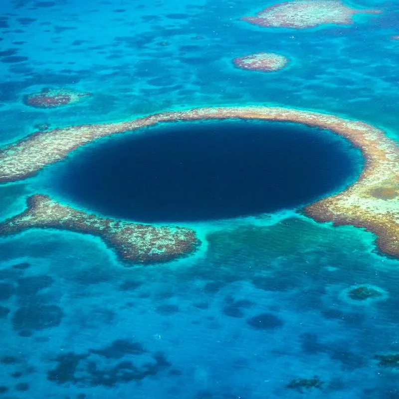 A large blue hole within a reef in the ocean