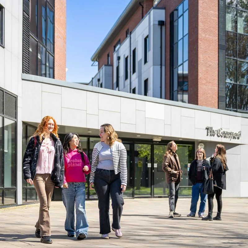 A group of students stood happily outside The Courtyard accommodation