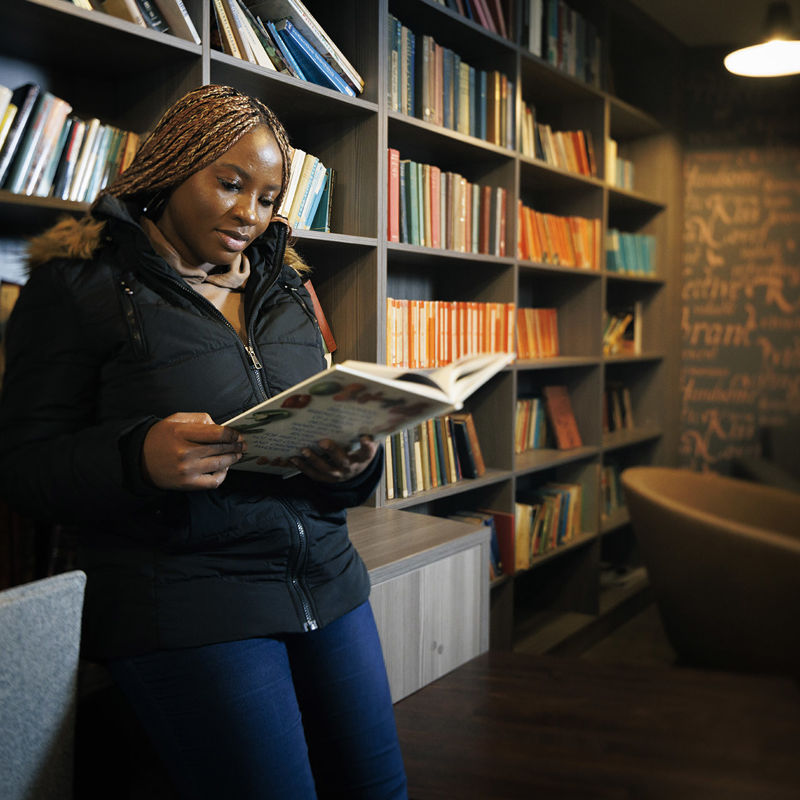 Student reading in the Courtyard Library