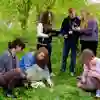Teachers and students on fieldwork in a green environment