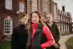 3 staff standing outside Venn Building