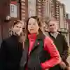 3 staff standing outside Venn Building