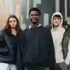 Three students stood on University of Hull campus.