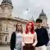 three students stood outside the maritime museum on a cloudy