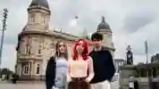  3 students standing outside the Hull maritime musuem