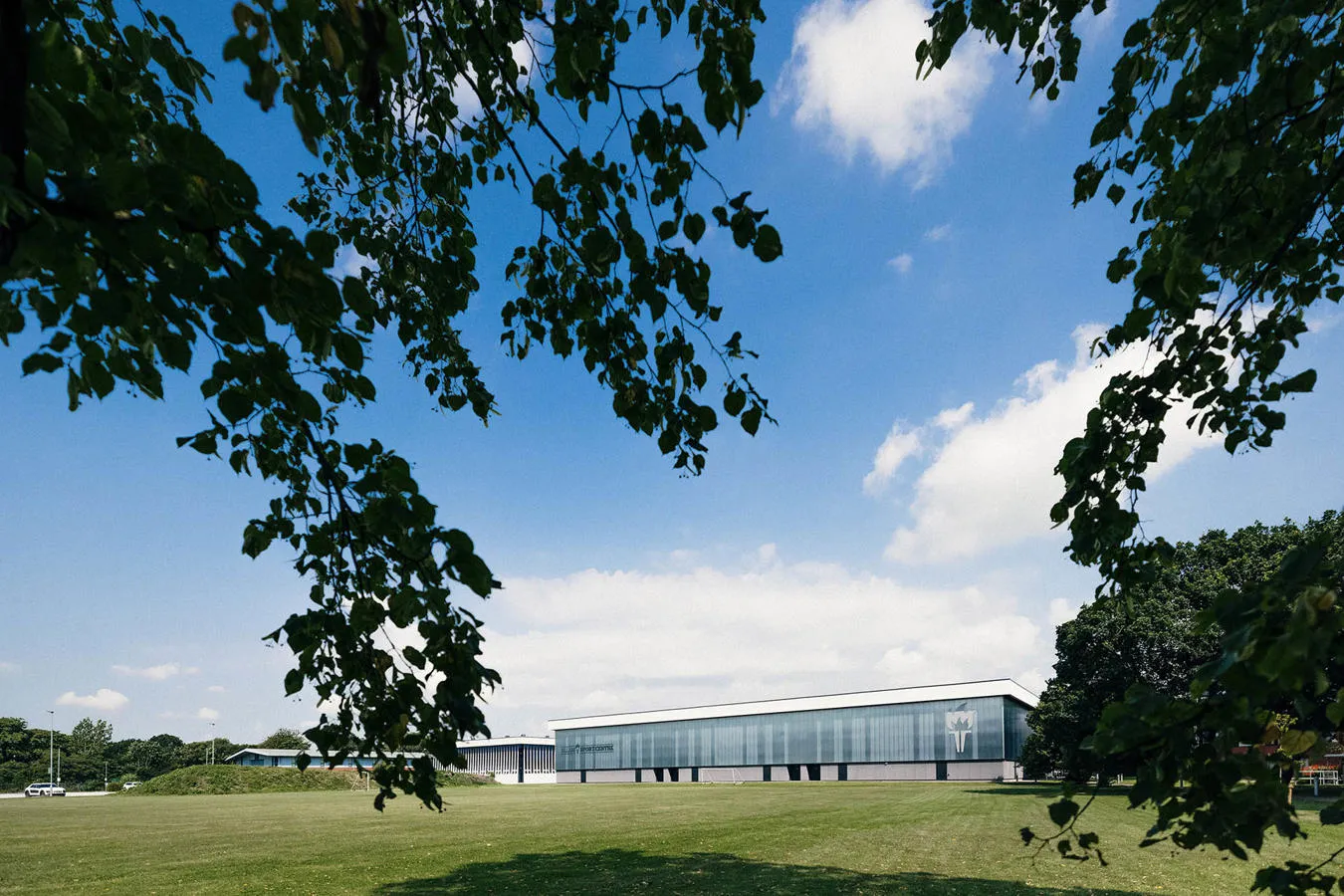 Allam sports centre exterior with blue sky.