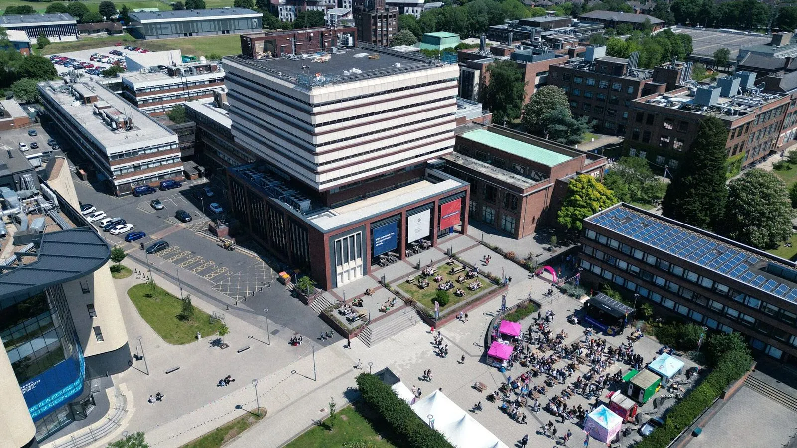 An aerial view of campus, focussing on the seven storey Brynmor Jones Library.