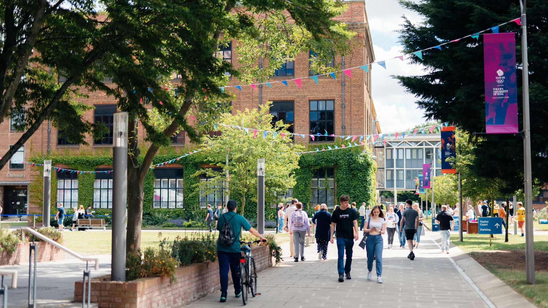 campus on a sunny day with lots of students walking