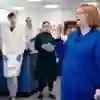 Teacher speaking to students in a biology lab