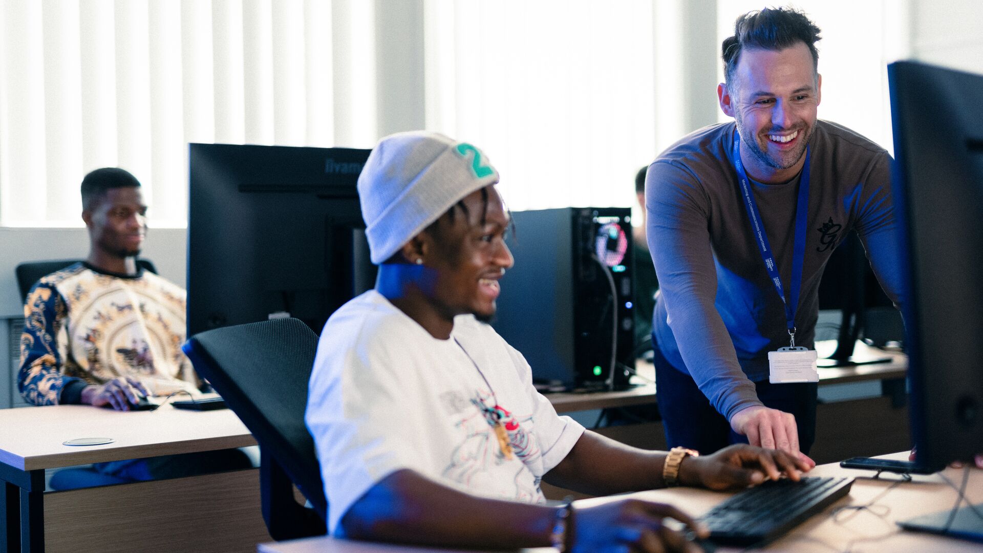 Lecturer helping a student on the computer