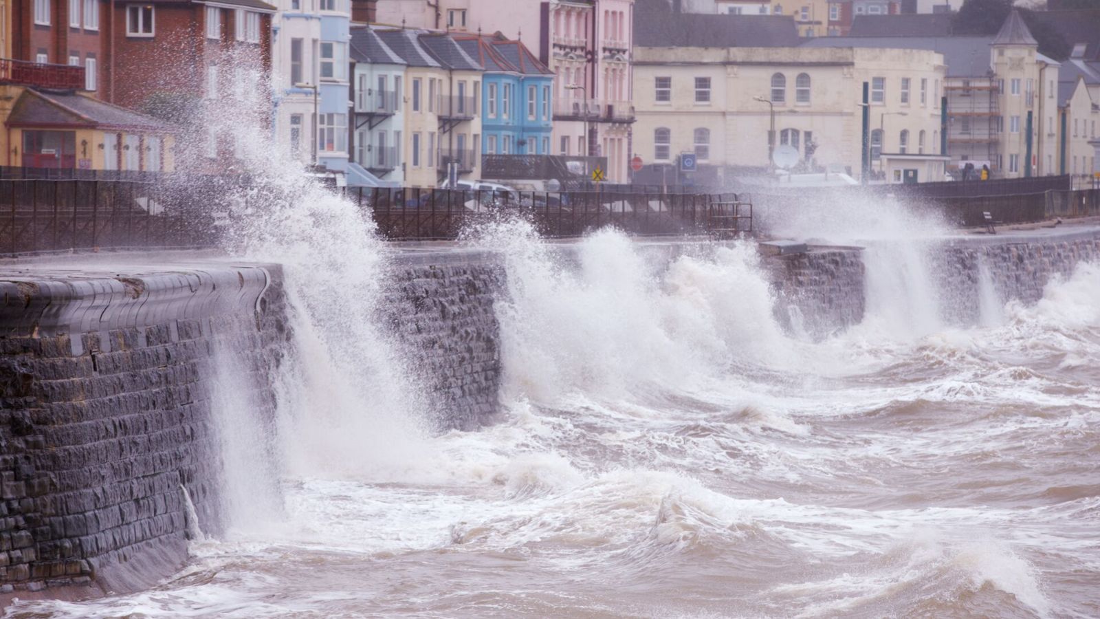 Rough waters flowing onto street 