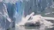 Ice cap breaking and falling into the ocean