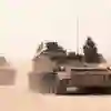 Two manned army tanks on patrol