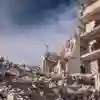Heavily bombed building surrounded by rubble