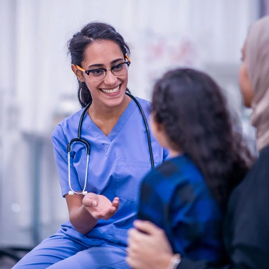 Doctor talking to mother and child
