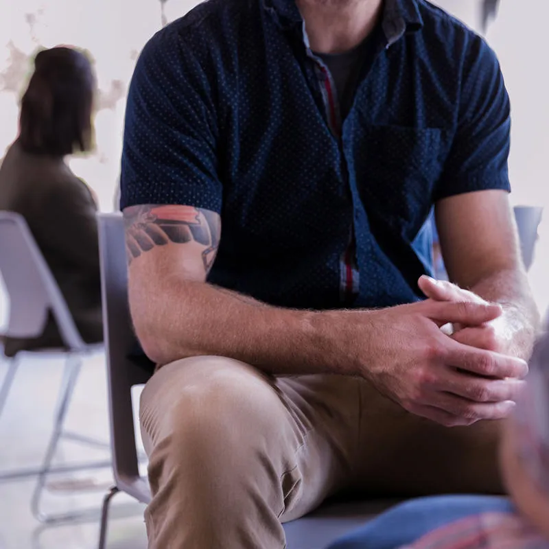 male figure with hands held toegether