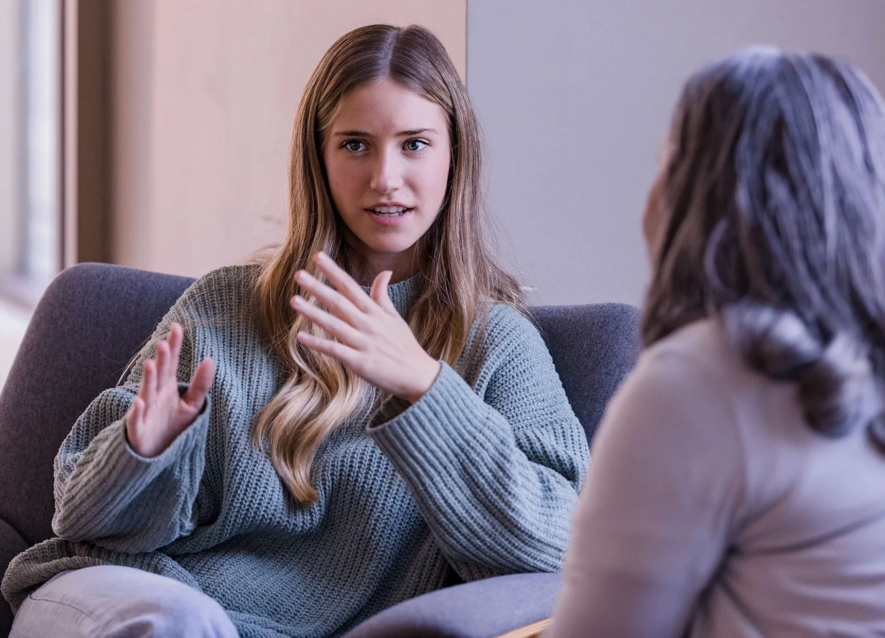 a student chatting to a student support staff memeber