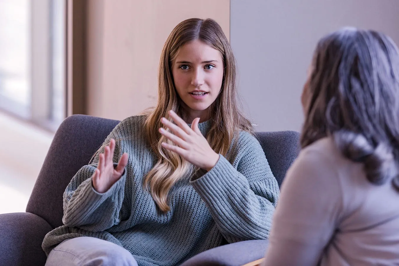 a student chatting to a student support staff memeber