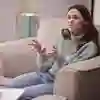 Young woman explaining something to someone in a comfortable setting