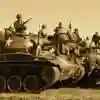 An old sepia photo of soldiers and tanks at war