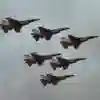 Six F16s Fighting Falcon aircraft flying through a cloudy sky