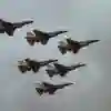 Six F16s Fighting Falcon aircraft flying through a cloudy sky