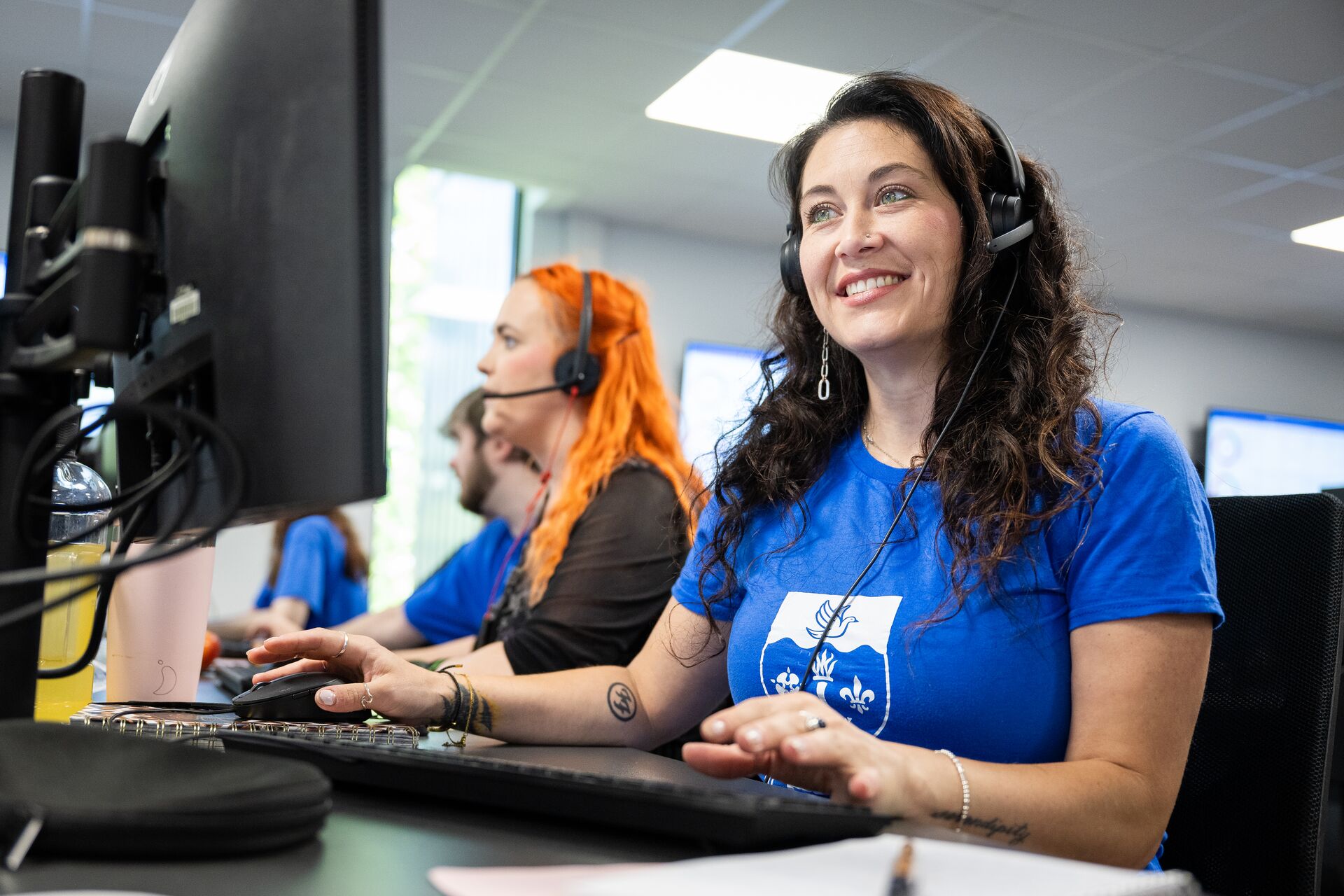 Two Clearing call centre staff on the phone looking for courses for  students