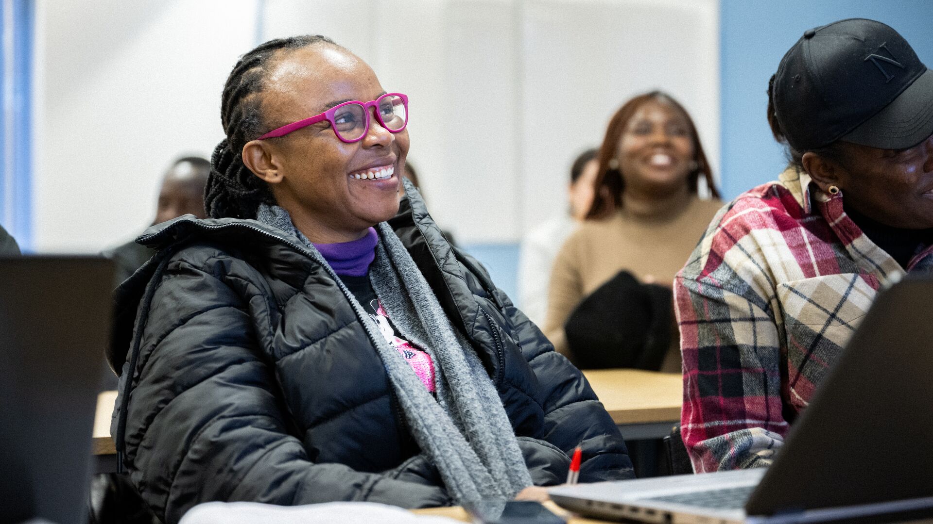 Smiling students enjoying a class