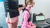 A student having a tracking clip attached to her sports vest