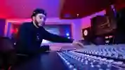 A student on the mixing desk