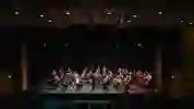A huge music ensemble on middleton hall stage