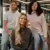 3 students sat on a table upstairs in the students' union