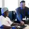 Lecturer helping a student on the computer