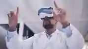 A researcher wearing a lab coat and VR headset