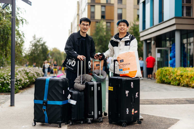 Two International Students arriving with all their bags