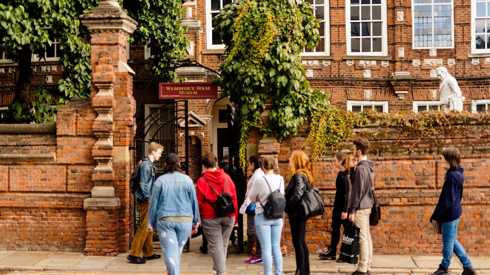 A group of people outside of the historic Wilberforce House