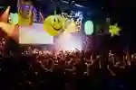 A large crowd parties underneath bright inflatables at our on-campus nightclub Asylum.