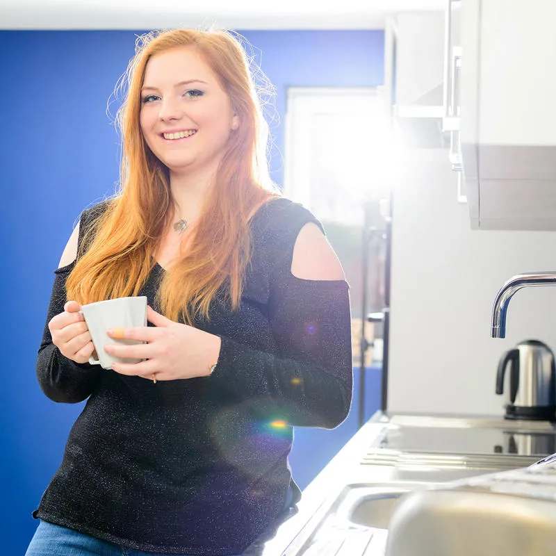 Girl standing in a kitchen in Westfield Court