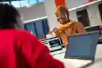 A medical student pictured with a laptop