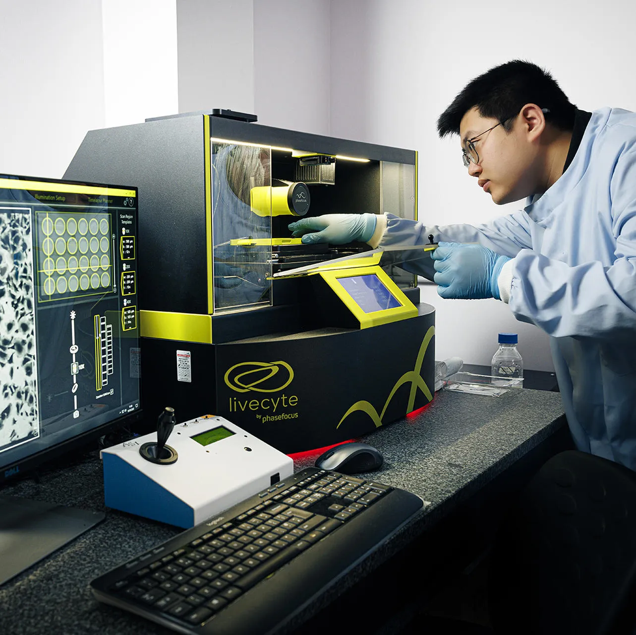 A Wound Innovation Institute researcher operates cell analysis equipment