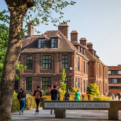 The announcement confirms the excellence of the teaching and exceptional student experience here at Hull. Front of campus with students walking near to the University of Hull sign
